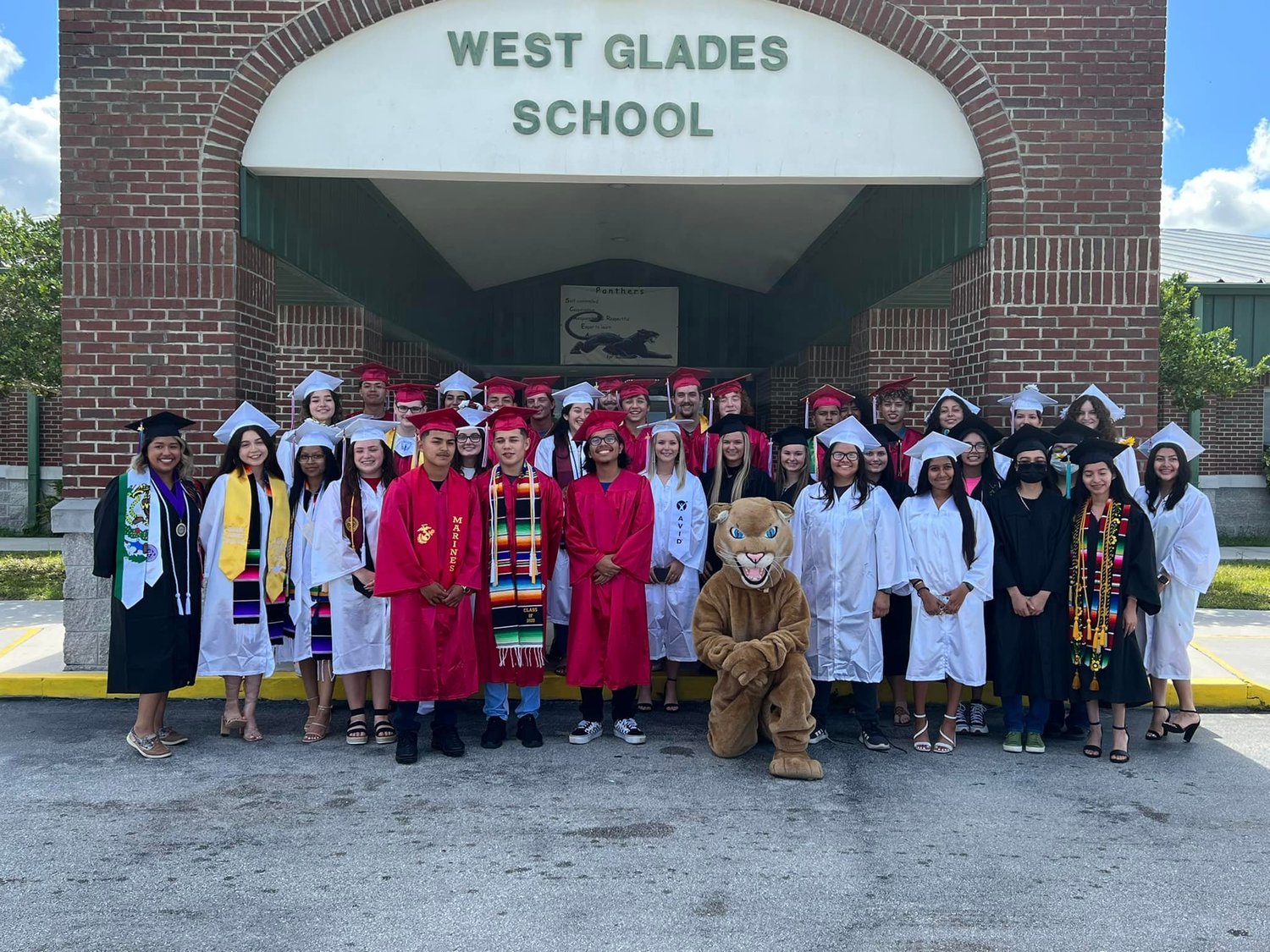 MUSE -- On May 13, West Glades School Alumni Seniors were cheered on by students and staff as they walked the halls one last time before graduating and starting a new chapter in life. [Photo courtesy West Glades School]